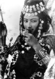 Berbers are the indigenous peoples of North Africa west of the Nile Valley. They are discontinuously distributed from the Atlantic to the Siwa Oasis, in Egypt, and from the Mediterranean to the Niger River. Historically they spoke various Berber languages, which together form a branch of the Afro-Asiatic language family.

Photograph by Lehnert & Landrock: Rudolf Franz Lehnert (Czech) and Ernst Heinrich Landrock (German) had a photographic company based in Tunis, Cairo and Leipzig before World War II. They specialised in somewhat risque Orinetalist images of young Arab and Bedouin women, often dancers.