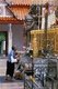 Thailand: A devotee at the main chedi, Wat Phra That Cho Hae, Phrae, Northern Thailand
